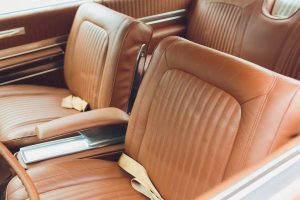 Pristine light brown vintage leather car seats. The inside door panels and console have the same leather in perfect condition.