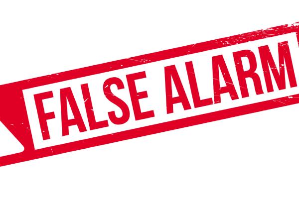 A red banner goes across a white background with an exclamation point in a triangle and the words “false alarm.”