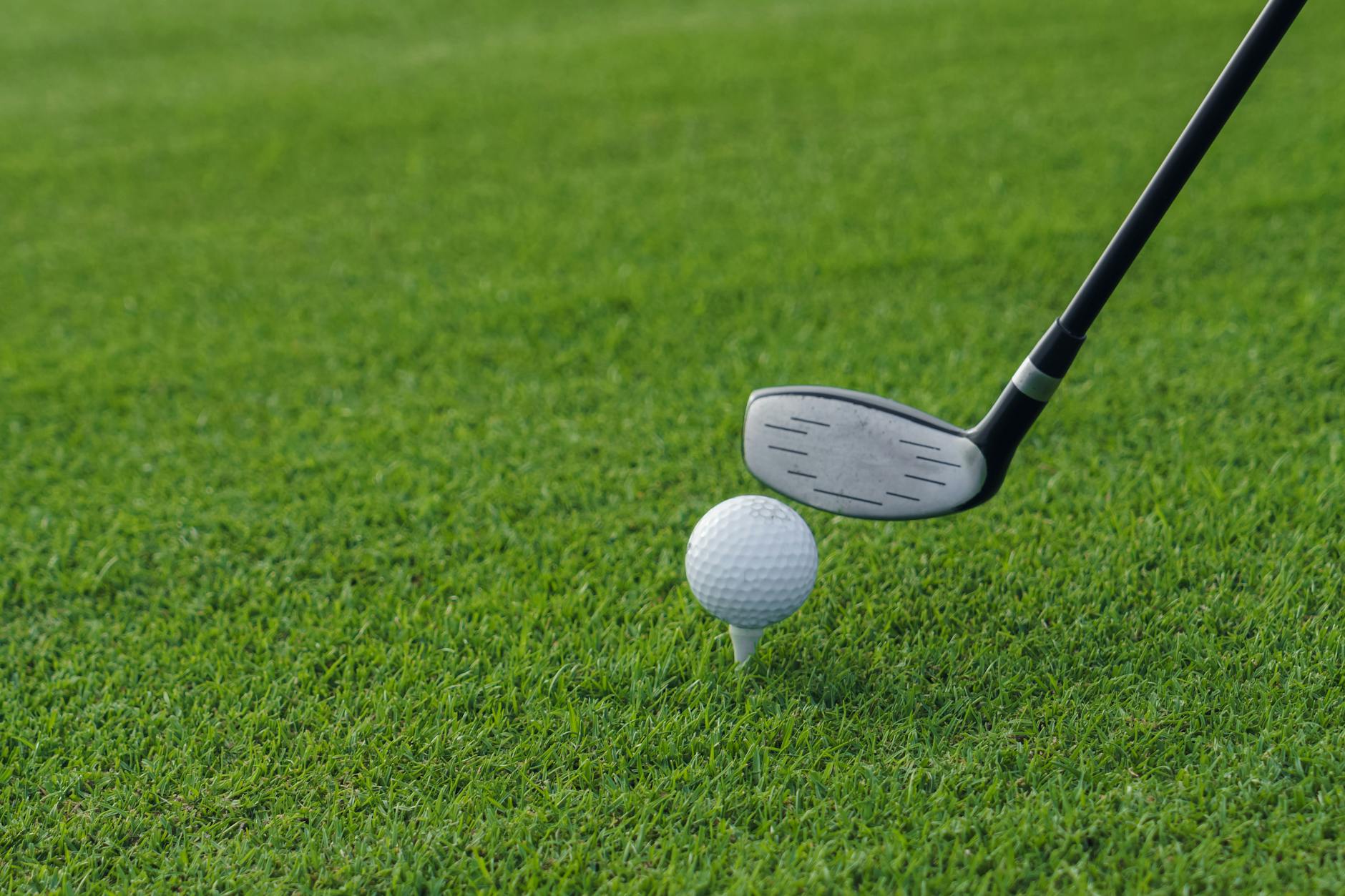 Krager golf club beside a golf ball