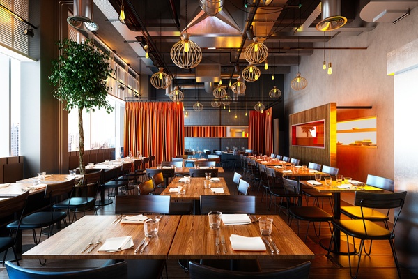 A modern restaurant dining room with wooden tables, warm pendant lighting, floor-to-ceiling windows, and seating areas.